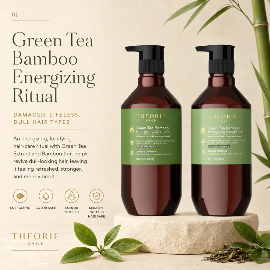 Two bottles of Theorie Green Tea Bamboo Energizing Ritual hair care products on a beige background with green leaves.