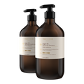 Two bottles of Theorie Argan Oil Shampoo and Conditioner on a white background